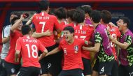 South Korea's players celebrate their goal during the Russia 2018 World Cup Group F football match between South Korea and Germany at the Kazan Arena in Kazan on June 27, 2018.   AFP / Roman Kruchinin
