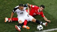 Costa Rica's David Guzman in action with Switzerland's Blerim Dzemaili. Reuters/Carlos Barria
