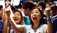 Japanese fans react as they watch a broadcast of the World Cup Group H soccer match Japan vs Poland, at a sports bar in Tokyo, Japan, June 29, 2018. REUTERS/Kim Kyung-Hoon