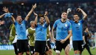 Soccer Football - World Cup - Round of 16 - Uruguay vs Portugal - Fisht Stadium, Sochi, Russia - June 30, 2018 Uruguay's Luis Suarez, Jose Gimenez and team mates celebrate after the match REUTERS/Murad Sezer