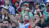 Russian supporters react while watching the match in a fan zone. REUTERS/Sergei Karpukhin
