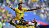 Brazil's forward Neymar celebrates with Brazil's midfielder Paulinho after scoring the opening goal during the Russia 2018 World Cup round of 16 football match between Brazil and Mexico at the Samara Arena in Samara on July 2, 2018.  AFP / Fabrice COFFRIN