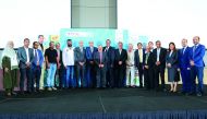 Senior officials of Aamal Trading and Contracting and TOTAL with the loyal customers at the event in Doha, recently. 