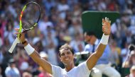 Spain's Rafael Nadal celebrates after winning against Australia's Alex De Minaur during their men's singles third round match on the sixth day of the 2018 Wimbledon Championships at The All England Lawn Tennis Club in Wimbledon, southwest London, on July 