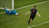 Croatia's Ivan Rakitic celebrates scoring the winning penalty in the shootout. (REUTERS/Christian Hartmann)