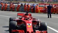 Ferrari's German driver Sebastian Vettel drives into the 'parc ferme' after the British Formula One Grand Prix at the Silverstone motor racing circuit in Silverstone, central England, on July 8, 2018. (AFP / Andrej ISAKOVIC)