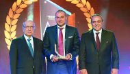 QIB Group CEO Bassel Gamal (centre) with WUAB officials duirng the awards ceremony in Beirut.