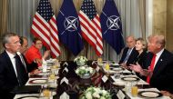 U.S. President Donald Trump holds a breakfast meeting with NATO Secretary General Jens Stoltenberg (L) at the NATO Summit in Brussels, Belgium, July 11, 2018. REUTERS/Kevin Lamarque