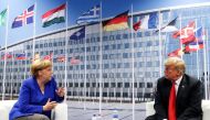 US President Donald Trump and German Chancellor Angela Merkel attend a bilateral meeting during the NATO Summit in Brussels, Belgium July 11, 2018. (REUTERS/Kevin Lamarque)