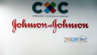 The logo of US multinational medical devices and pharmaceutical company Johnson & Johnson at the entrance of the research and development plant, in Val-de-Reuil, northwestern France on November 30, 2017. AFP / Charly Triballeau
