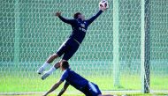France's forward Antoine Griezmann (R) vies with France's defender Lucas Hernandez during a training session at the Glebovets stadium in Istra, some 70 km west of Moscow on July 12, 2018, ahead of their Russia 2018 World Cup final football match against C