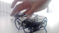 Engine maker Rolls-Royce demonstrates one of its robots, inspired by snakes and cockroaches, that could be used in the future to help it inspect and repair engines, at the Farnborough International Airshow, July 17, 2018. Reuters/Victoria Bryan