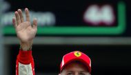 Ferrari's Sebastian Vettel celebrates after qualifying in pole position Reuters/Wolfgang Rattay