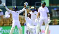 Sri Lankan cricketer Akila Dananjaya (2L) celebrates after he dismissed South African cricketer Dale Steyn (R) looks on during the second day of the second Test match between Sri Lanka and South Africa at the Sinhalese Sports Club (SSC) international cric