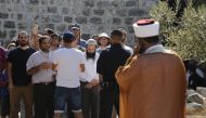 
More than 1,000 Israeli settlers including children are their way into East Jerusalem’s flashpoint Al-Aqsa Mosque compound backed by Israeli police officers, at the Al-Aqsa Complex in Jerusalem on July 22, 2018. (Mostafa Alkharouf/Anadolu Agency)
