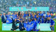 Leicester City’s players and officials celebrate with the trophy after winning the English Premier League title in this May 7, 2016 file photo.
