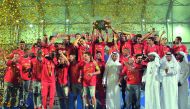 Al Duhail players and officials celebrate with the 2017 QNB Stars League trophy in this file photo.