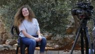 Palestinian activist and campaigner Ahed Tamimi, 17, smiles during an interview with AFP in the West Bank village of Nabi Saleh on July 30, 2018, following her release from prison yesterday after an eight-month sentence for slapping Israeli soldiers, an e