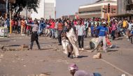 Supporters of Zimbabwe's MDC party demonstrate outside ZANU PF headquarters in Harare on August 1, 2018, as protests erupted over alleged fraud in the country's election. AFP / Marco Longari 
