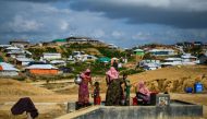 Rohingya refugees collect water at Kutupalong camp in Ukhia on August 8, 2018. AFP / Chandan Khanna