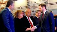 Turkish Treasury and Finance Minister Berat Albayrak shakes hands with Guler Sabanci, Sabanci Group Chairman of the Board, before a presentation to announce his economic policy in Istanbul, Turkey August 10, 2018. Reuters/Murad Sezer