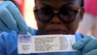 File photo of a World Health Organization (WHO) worker prepares to administer a vaccination during the launch of a campaign aimed at beating an outbreak of Ebola in the port city of Mbandaka, Democratic Republic of Congo May 21, 2018. REUTERS/Kenny Katomb