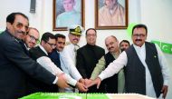 Murad Baseer (centre), Charge d’Affaires at the Embassy of Pakistan, cutting a cake with other officials at the embassy premises yesterday. Pic: Abdul Basit / The Peninsula