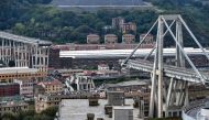 A general view shows the Morandi motorway bridge after a section collapsed earlier in Genoa on August 14, 2018. AFP / Piero Cruciatti 