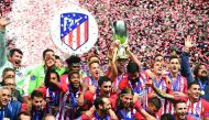 Atletico Madrid's players celebrate with the trophy after winning the UEFA Super Cup football match Atletico de Madrid vs Real Madrid CF at the Lillekula Stadium in Tallinn, Estonia, on August 15, 2018. AFP / Janek Skarzynski