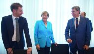  Saxony's Prime Minister Michael Kretschmer, German Chancellor Angela Merkel and parliamentary party leader of the CDU in Saxony Frank Kupfer arrive for a meeting of the CDU party in Saxony state in Dresden, on August 16, 2018. AFP / dpa / Sebastian Kahne