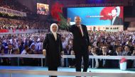 Turkish President Tayyip Erdogan (R) and his wife Emine Erdogan (L), greet supporters ruling Justice and Development Party (AKP) during the sixth congress of the ruling AK party (AKP) to prepare for March local election in Ankara on August 18, 2018. (AFP 