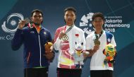 Gold medallist Yang Haoran of China (C), silver medallist Deepak Kumar (L) of India and bronze medallist Lu Shaochuan (R) of Taiwan during the medal ceremony. REUTERS/Edgar Su