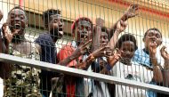Migrants of the immigrant center CETI welcomes newly arrived African immigrants in the Spanish enclave Ceuta, after some 200 refugees crossed the border fence between Morocco and Ceuta August 22, 2018. REUTERS/Fabian Bimmer