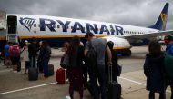 Passengers wait to board a Ryanair flight at Gatwick Airport in London, Britain. Aug 23, 2018. REUTERS/Hannah McKay