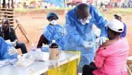 FILE PHOTO: A Congolese health worker administers Ebola vaccine to a woman who had contact with an Ebola sufferer in the village of Mangina in North Kivu province of the Democratic Republic of Congo, August 18, 2018. REUTERS/Olivia Acland