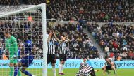Newcastle players react after Newcastle United's US defender DeAndre Yedlin (2R) scored an own goal for Chelsea's second during the English Premier League football match between Newcastle United and Chelsea at St James' Park in Newcastle-upon-Tyne, north 