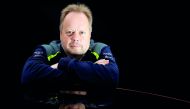 Andy Palmer, CEO of Aston Martin, poses for a photograph next to the company's new Vantage car in Gaydon, Britain November 20, 2017. Reuters/Phil Noble