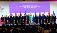 Singapore Prime Minister Lee Hsien Loong (9th from L) poses with the Asean economic and trade ministers at the opening of 50th Asean Economic Ministers (AEM) Meeting and Related Meetings in Singapore on August 29, 2018. AFP / Roslan Rahman