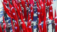 Turkish soldiers take part in a parade from the Grand National Assembly of Turkey (TBMM) to the first Turkish Grand National Assembly building in the Ulus district during celebrations to mark 96th Anniversary of Turkey’s Victory Day which commemorates dec