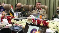 Syrian military commanders seated during a security cooperation and information-sharing meeting with their Iraqi, Iranian, and Russian counterparts in the Iraqi capital Baghdad. AFP
