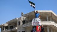 Syrian oppositions demanding Turkey to prevent attacks on Idlib, chant slogans as they protest against regime forces' possible attacks in Syria's Idlib province on August 31, 2018. Ahmet Cerban - Anadolu 