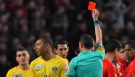 FILE PHOTO: Paris Saint-Germain's French forward Kylian Mbappe (L) reacts as the referee gives him a red card during the French League Cup football semi-final match between Rennes and Paris Saint-Germain at the Roazhon Park stadium in Rennes.  AFP / LOIC 