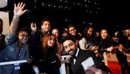 Actor Abhishek Bachchan poses with fans as he arrives for the premiere of Husband Material at the Toronto International Film Festival in Toronto, Ontario, Canada, September 11, 2018. REUTERS/Mark Blinch