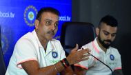 In this file photo taken on June 22, 2018 Indian cricket team head coach Ravi Shastri (L) speaks as captain Virat Kohli looks on during a press conference in New Delhi. Getty/ AFP / Prakash Singh 