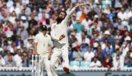England's Moeen Ali bowls during play on the third day of the fifth Test cricket match between England and India at The Oval in London on September 9, 2018. AFP / Adrian DENNIS /