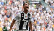 Juventus' Portuguese forward Cristiano Ronaldo celebrates after he scored his first goal since he joined Juventus during the Italian Serie A football match Juventus vs Sassuolo on September 16, 2018 at the Juventus stadium in Turin. / AFP / Miguel MEDINA