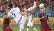 Los Angeles Galaxy forward Zlatan Ibrahimovic (9) scores a goal during the first half against Toronto FC at BMO Field. Mandatory Credit: Nick Turchiaro
