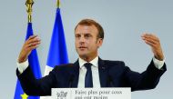 French President Emmanuel Macron gestures as he delivers a speech on poverty to social aid workers in Paris, France, September 13, 2018. Picture taken September 13, 2018. Michel Euler/Pool via Reuters