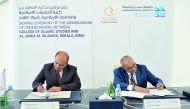 Emad El Din Shahin, Dean of CIS, and Dr Abdussalam Ahmed, Rector of Al Jamia Al Islamiya, signing the agreement in the presence of distinguished guests.
