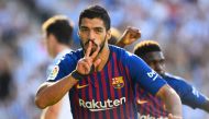 Barcelona's Uruguayan forward Luis Suarez celebrates after scoring a goal during the Spanish league football match between Real Sociedad and FC Barcelona at the Anoeta stadium in San Sebastian on September 15, 2018. / AFP / GABRIEL BOUYS